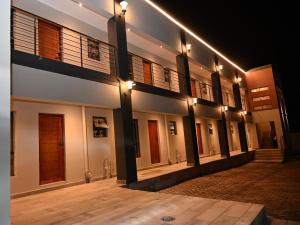 a building with lights on the side of it at night at Gae Ga Monare Guest House in Burgersfort