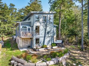 a tiny house in the woods with trees at Sasquatch House MCA#50631 in Manzanita