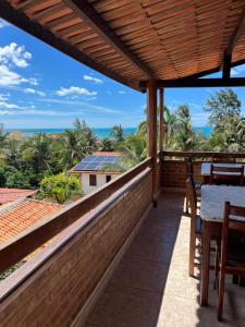 a balcony with a view of the ocean at Bela Vista in Canoa Quebrada