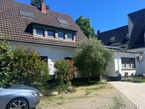 a house with a car parked in front of it at Ahrweiler Seelchen in Bad Neuenahr-Ahrweiler