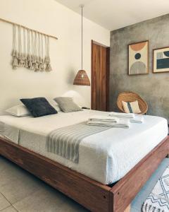 a bedroom with a large bed in a room at TAGUA LODGE in Tena