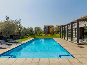a swimming pool on the side of a building at Luxury Sunset Gem with Power Backup in Sandton