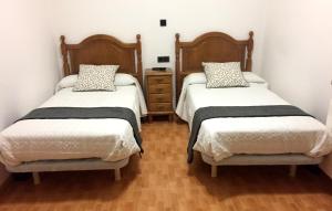 Ένα ή περισσότερα κρεβάτια σε δωμάτιο στο Hostal La Casilla +22 φωτογραφίες