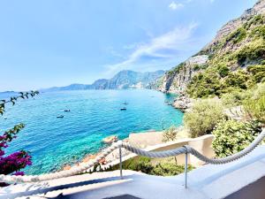 a view of a body of water with a beach at Suite Sole Praiano in Praiano +45 photos