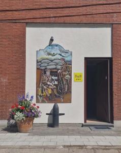 a mural on the side of a building at B&B The Protea in Zonnebeke