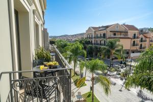 a balcony with a table with bananas on it at PERATZADA central suite in Argostoli