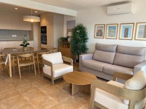 a living room with a couch and a table at Veracruz-Fincas Benidorm in Benidorm