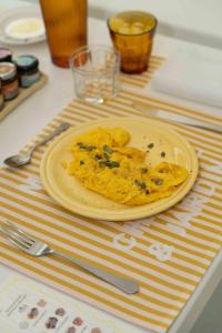 a plate of food sitting on top of a table at Maison Chambre et Jardin in San Martino in Rio +98 photos