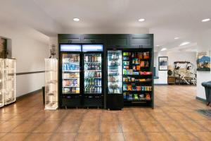a store with two large refrigerators in a room at Tombstone Grand Hotel, a Baymont by Wyndham in Tombstone