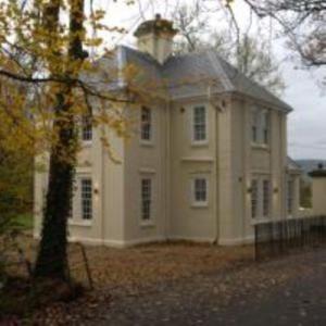 a large white house with a tower on top of it at Hilston Gate House in Skenfrith
