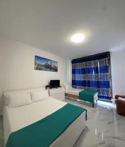 a living room with a bed and a couch at Venice Night 11 in Mestre