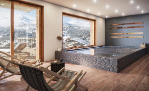 a hot tub in a room with chairs and mountains at TERRESENS - Les Balcons de Juliette in Notre-Dame-de-Bellecombe