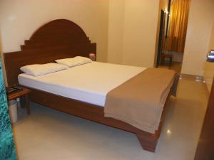 Postel nebo postele na pokoji v ubytování Hotel Rajdeep