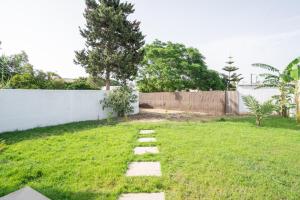 a garden with a stone path in the grass at La Tertulia in Zahora