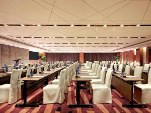 a large conference room with tables and chairs at Pullman Xiamen Powerlong in Xiamen +148 photos