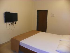 Postel nebo postele na pokoji v ubytování Hotel Rajdeep