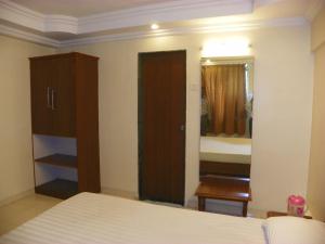 Postel nebo postele na pokoji v ubytování Hotel Rajdeep