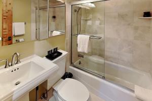 a bathroom with a sink and a toilet and a shower at Timberline Condominiums 2 Bedroom Deluxe Unit D2D in Snowmass Village +16 photos