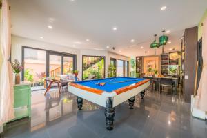 a pool table in the middle of a room at The Coastal Haven pool villa in Hoi An