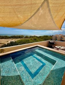 a large swimming pool on top of a house at Sea View Rooftop in Cabo Rojo