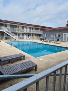 a swimming pool in front of a building at Best location Cozy condo in Biloxi Beach in Biloxi