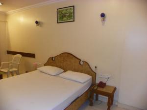 Postel nebo postele na pokoji v ubytování Hotel Rajdeep