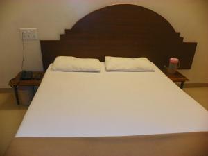 Postel nebo postele na pokoji v ubytování Hotel Rajdeep
