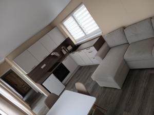 an overhead view of a living room with a couch at Bianka & Blanka in Poľný Kesov