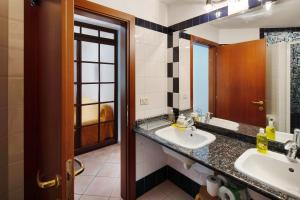 a bathroom with a sink and a mirror at Casa Morsich in Predazzo +33 photos