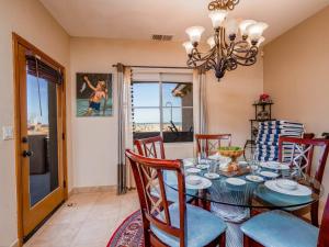 a dining room with a glass table and chairs at Condo 40-4 El Dorado Ranch in San Felipe