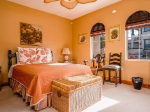 a bedroom with a bed and a chair and windows at Condo 40-4 El Dorado Ranch in San Felipe +26 photos