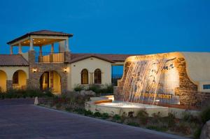 a home with a fountain in front of a building at Condo 40-4 El Dorado Ranch in San Felipe