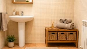 a bathroom with a sink and a counter with towels at Unique and special loft in Sant Joan de les Abadesses +32 photos