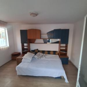a bedroom with a bed and a bunk bed at CASA Ysy SUD in Eforie Sud