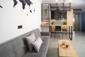 a living room with a couch and a table at DG space 1A in Kalamata