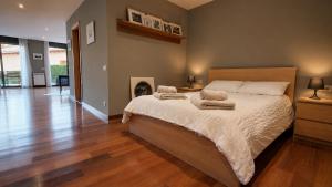 a bedroom with a bed with two towels on it at Unique and special loft in Sant Joan de les Abadesses