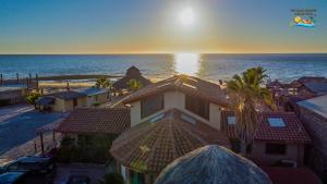 a view of a house with the ocean in the background at Rancho Percebu Beach Studio 5 in San Felipe