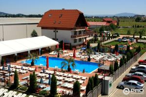 an aerial view of a resort with a swimming pool at GARDEN Club - Hotel & Restaurant - FREE Outdoor Pool & Parking in Braşov