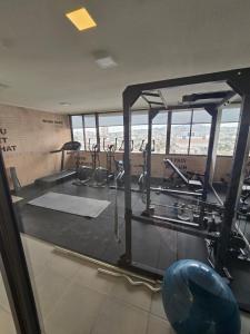 a gym with a row of treadmills and machines at Baquedano in Coquimbo