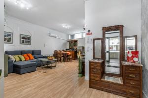 a living room with a couch and a table at Bom Braga AL in Braga