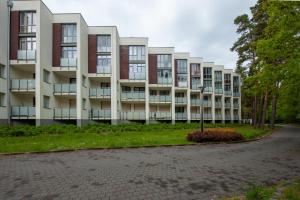 an apartment building with a street light in front of it at Apartament u Jadwigi in Jantar