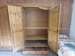 a bedroom with a bunk bed with wooden walls at Ruhige Ortsrandlage 1 in Kiel