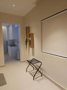 a large projection screen on a wall in a room at شقق عبادي مميزه 1 in Dammam +6 photos