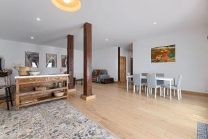 a living room with a dining room table and chairs at Casa Eleizpe by Next Stop Bilbao in Ergoyen