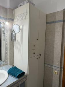 a bathroom with a sink and a shower and a cabinet at The Spartan Horizon in Sparta +18 photos
