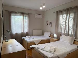 a bedroom with two beds and a window at The Spartan Horizon in Sparta