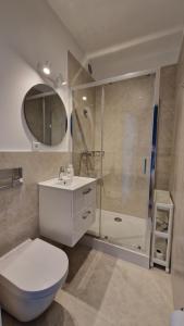 a bathroom with a toilet sink and a shower at Hello Bielsko Biała in Bielsko-Biała +53 photos