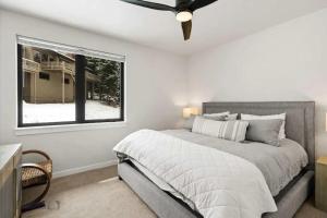 a bedroom with a bed and a window at Cozy Luxury in Big Sky in Big Sky