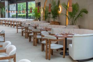 a row of tables and chairs in a restaurant at ModernHaus SoHo in New York