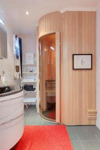 a kitchen with a red rug in a room at RIBO Apartment Katterjåkk in Riksgränsen